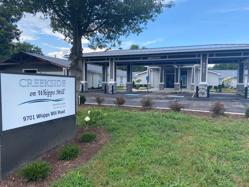Exterior view of Creekside on Whipps Mill entrance with sign and driveway