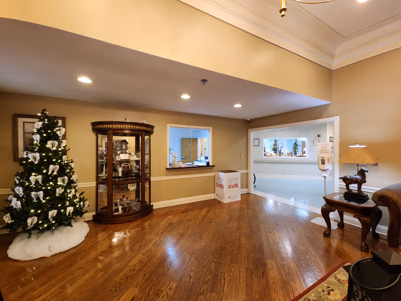 The Heritage Nursing & Rehabilitation Facility lobby with Christmas tree and reception window.