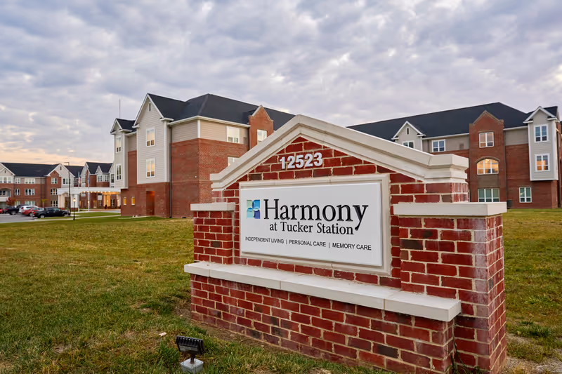 Signage for Harmony at Tucker Station located in front of the building.