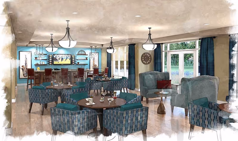 Bright communal lounge and dining area with round tables, patterned armchairs, a bar with stools, and large windows.