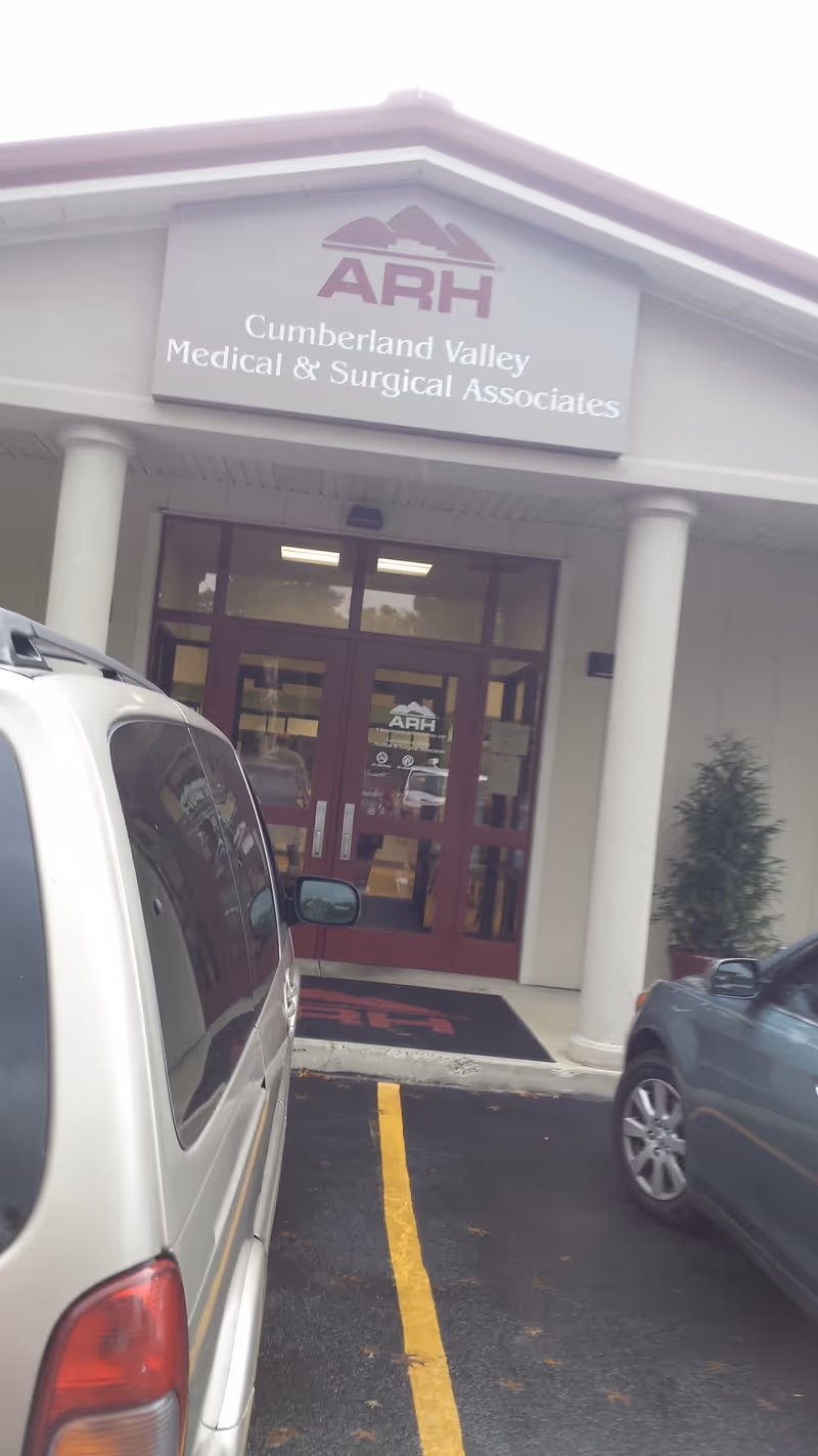 Exterior view of ARH Cumberland Valley Medical & Surgical Associates entrance with parked cars.