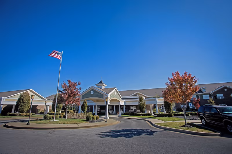 Bridgepointe at Ashgrove Woods exterior front view with flagpole and entrance
