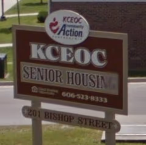A front signboard reads KCEOC Senior Housing at the facility entrance.