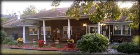 Front view of Elizabethtown Nursing and Rehabilitation Center, brick building with a covered porch.