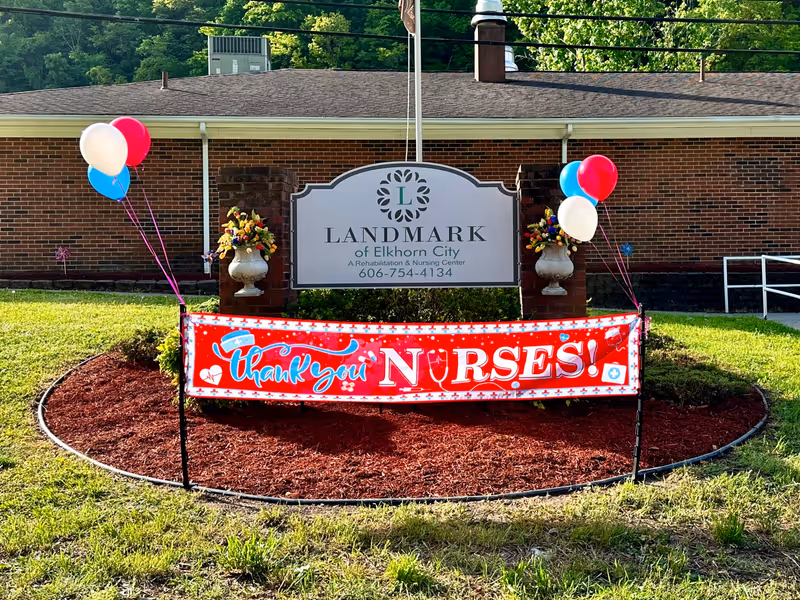 Exterior view of Landmark of Elkhorn City with balloons and a Thank you NURSES banner.
