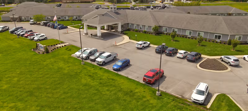 Aerial view of Providence Pointe Healthcare exterior with parking and green lawn.